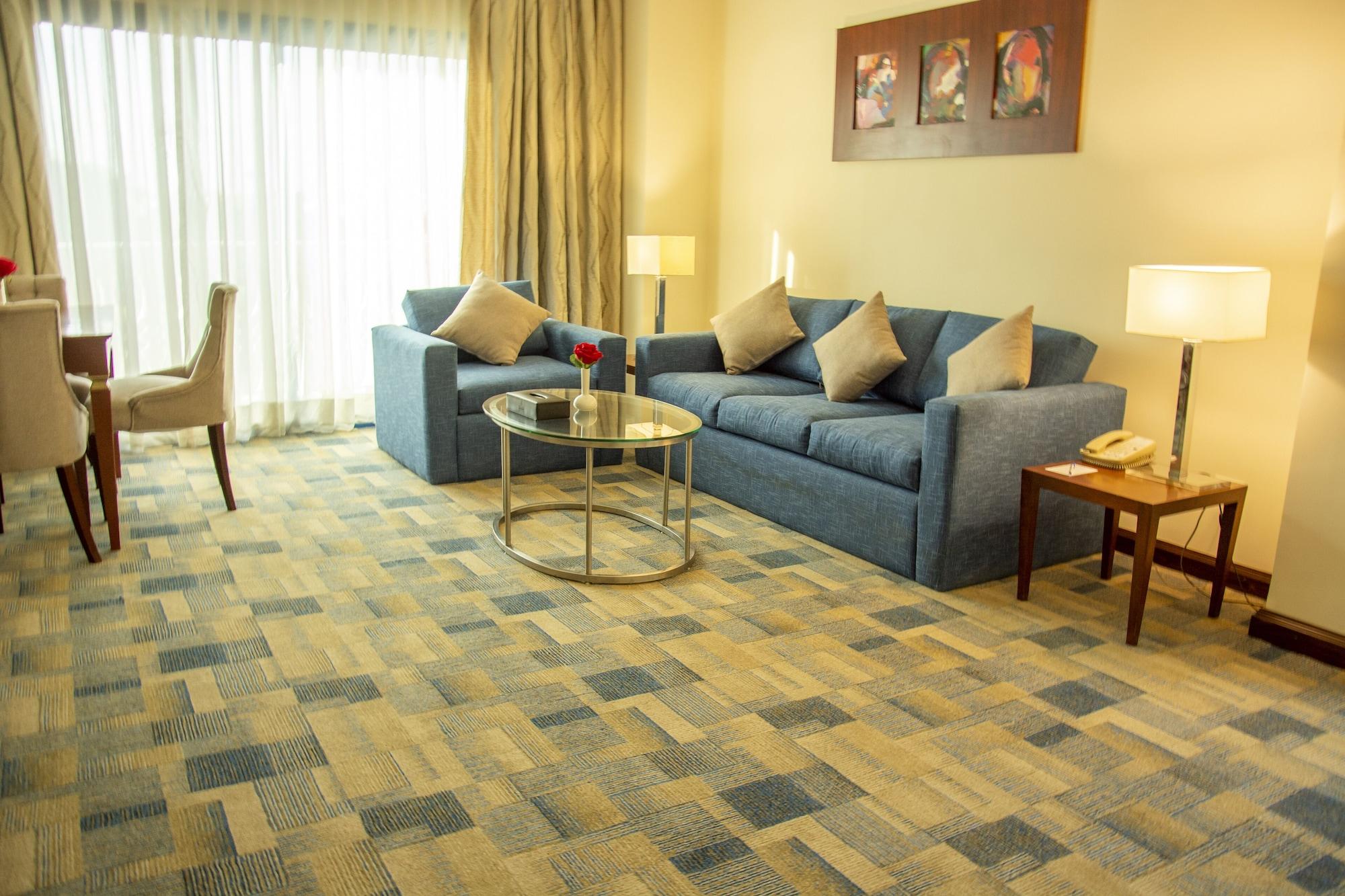 梦境赫尔南国际酒店 6th of October City 外观 照片 A living room with carpet flooring